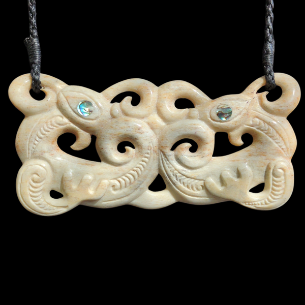 Pekapeka Parāoa - Whale Rib Bone Bat Pendant Front - Sands Carving Studio
